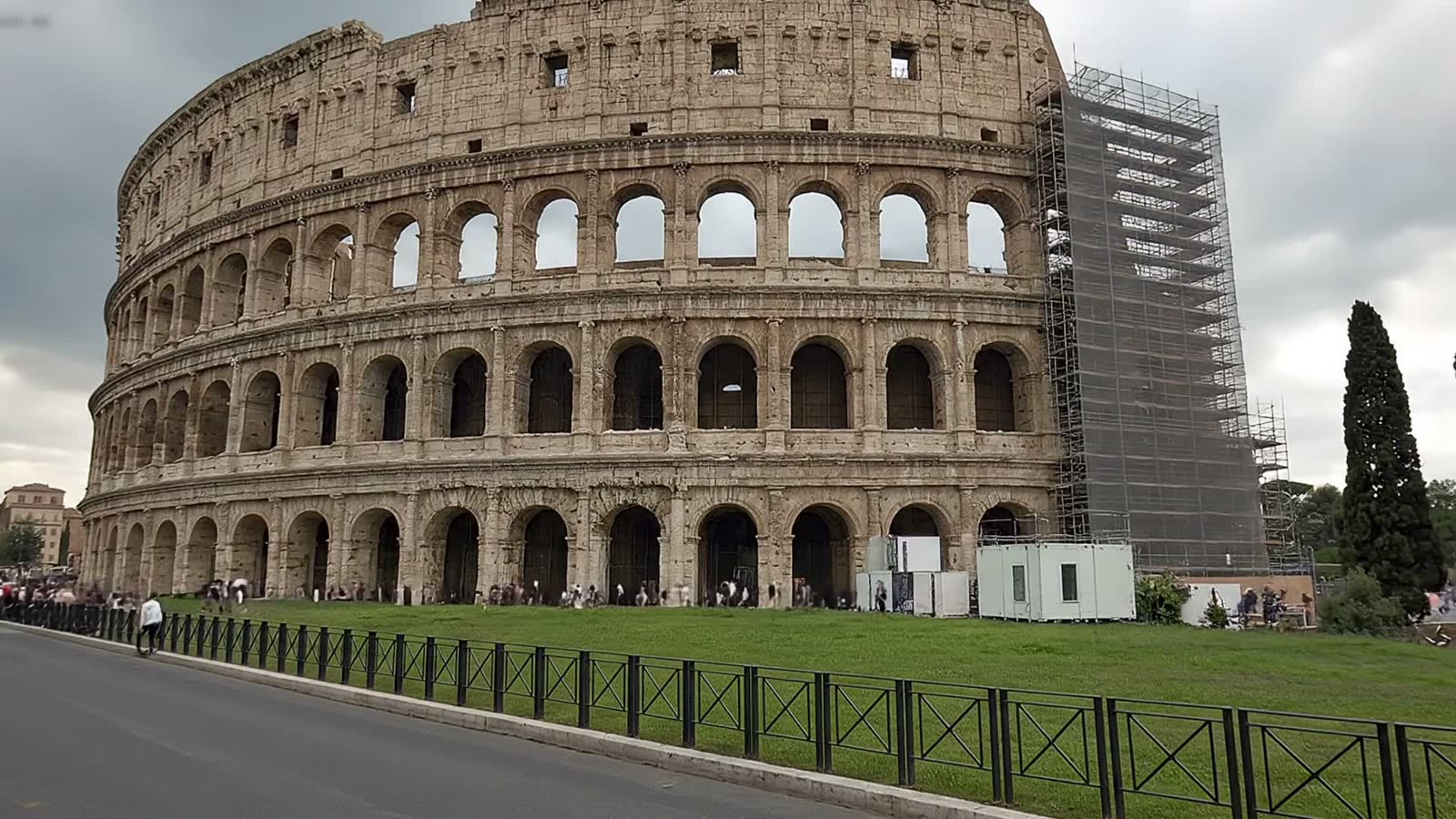 The Colosseum in 2015, scaffolding, tourists and modern railings